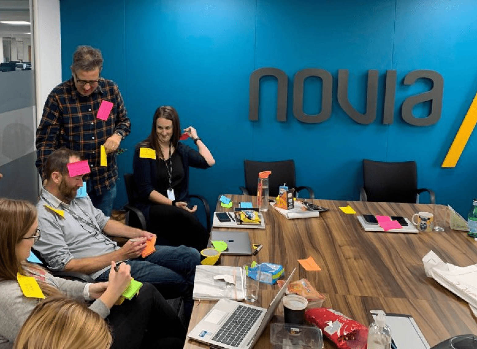 Wealthtime employees coming up with new ideas on post-it notes